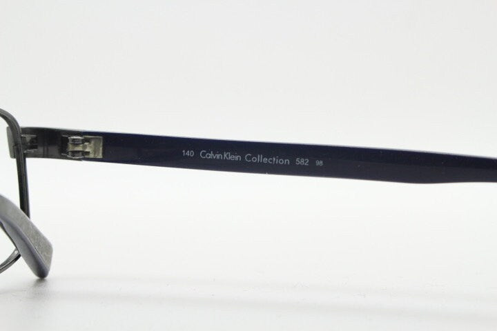 Calvin Klein collection rectangular eye glasses model 582 made in Japan. Gunmetal grey wire optical frames. Prescription eyeglasses. RX
