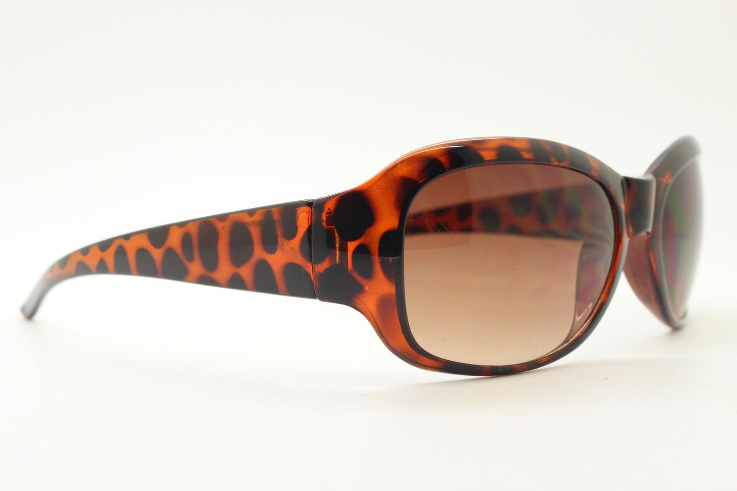 Y2k vintage wrap around bug eye sunglasses. Curved tortoise gloss frame with gradient Havana brown lenses. 2000's NOS