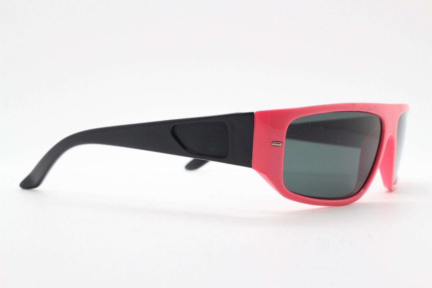 80s vintage 2 tone sunglasses. Aerodynamic flat top shield style wrap around frame in pink and black with real glass lenses. Unused NOS