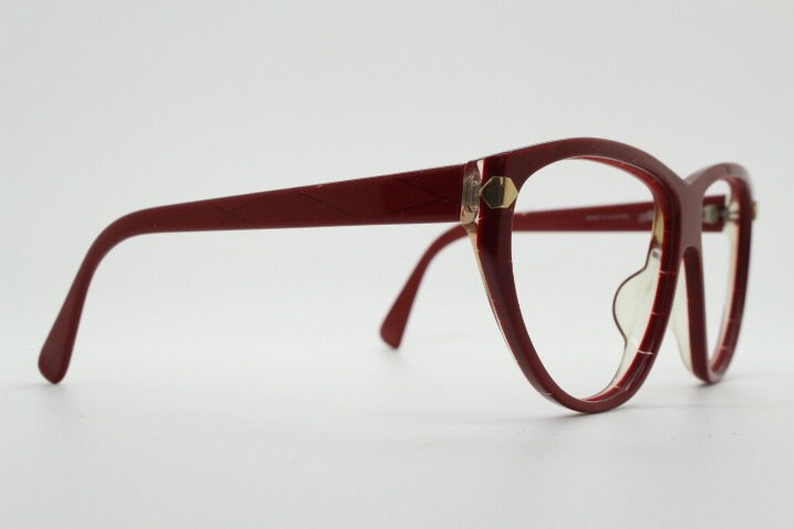 Silhouette 80s vintage oversized cat eye glasses made in Austria. Dramatic red prescription optical frame with subtle criss cross stripes RX