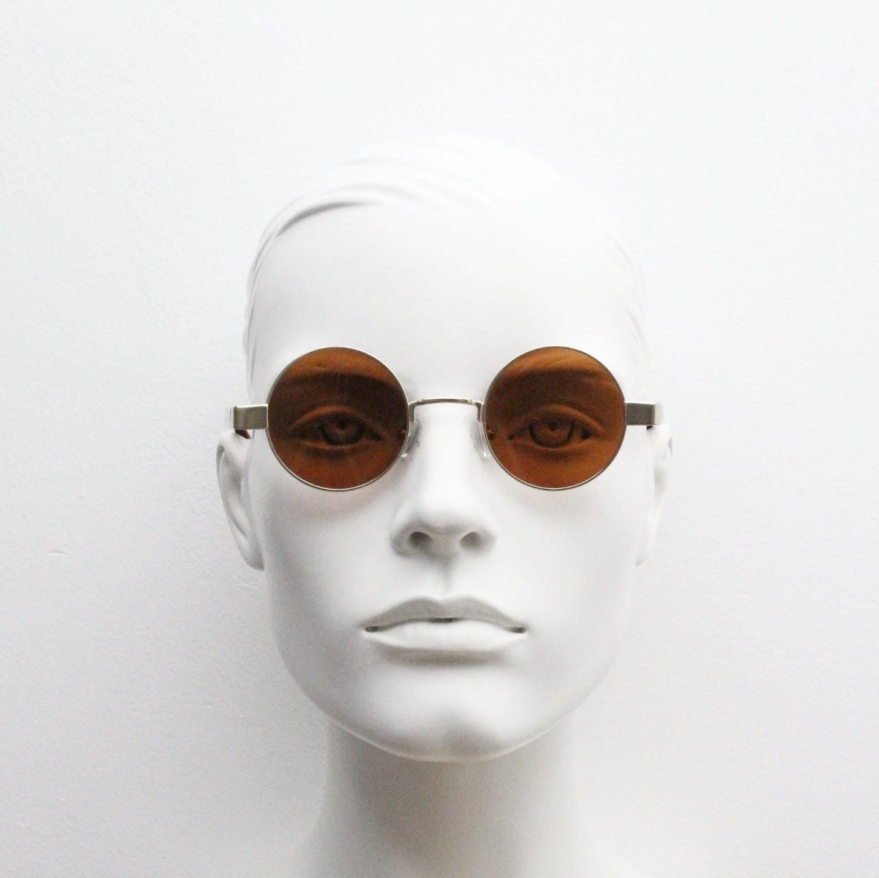 90s round vintage sunglasses. Gold 1920's style frame with tiger pattern arms and brown lenses. Unused. BNWT