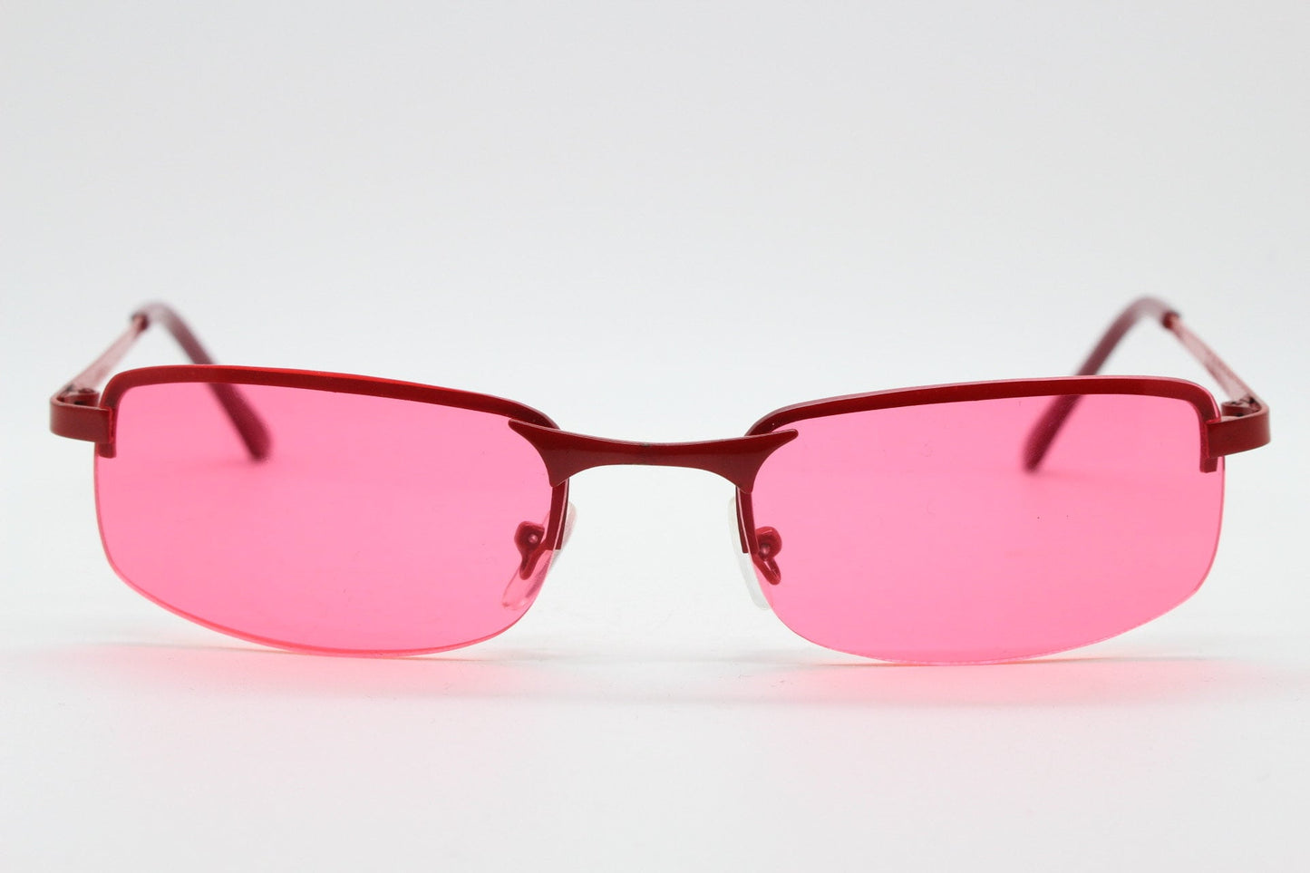 Y2K vintage half frame sunglasses with rectangular pink lenses and matching frame colours. 2000s NOS. 00's. 90s Rave