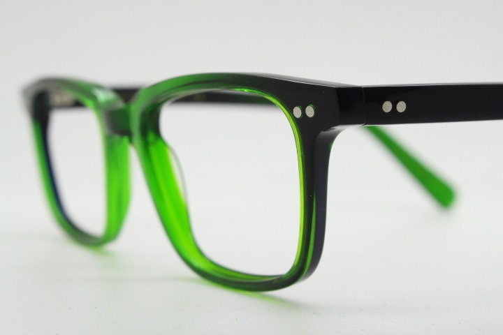 Green rectangular low profile wayfarer design eye glasses by found of Switzerland. Green gloss acetate optical frames. Prescription RX