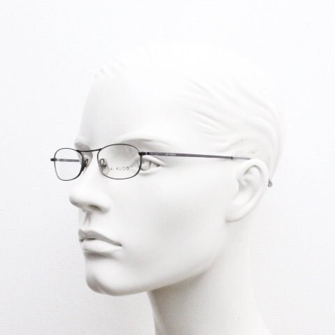 Jai Kudo 90s vintage oval eye glasses. Small low profile optical frames in charcoal grey chrome. Prescription eyeglasses. RX Spectacles