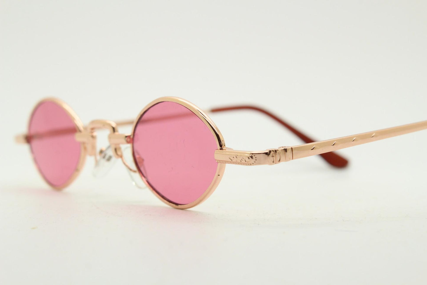 90s vintage small oval sunglasses. Imposing minimal rose gold metal victorian style frame with shocking pink lenses. Steampunk. BNWT