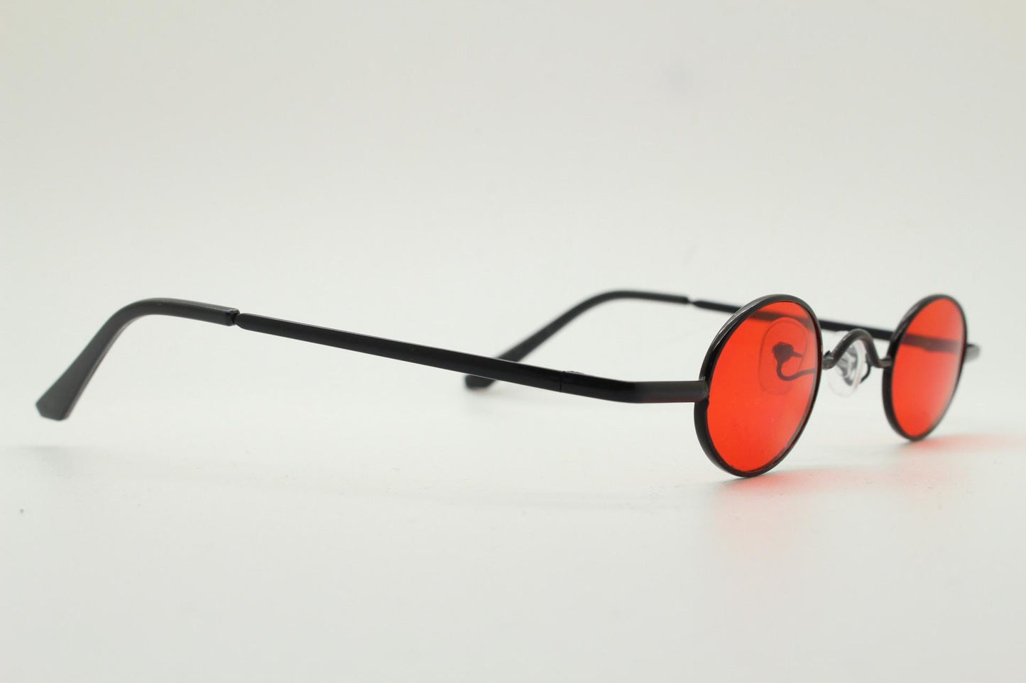 90s vintage small oval sunglasses. Imposing minimal black gloss metal victorian antique style frame with bright red lenses. Steampunk. NOS