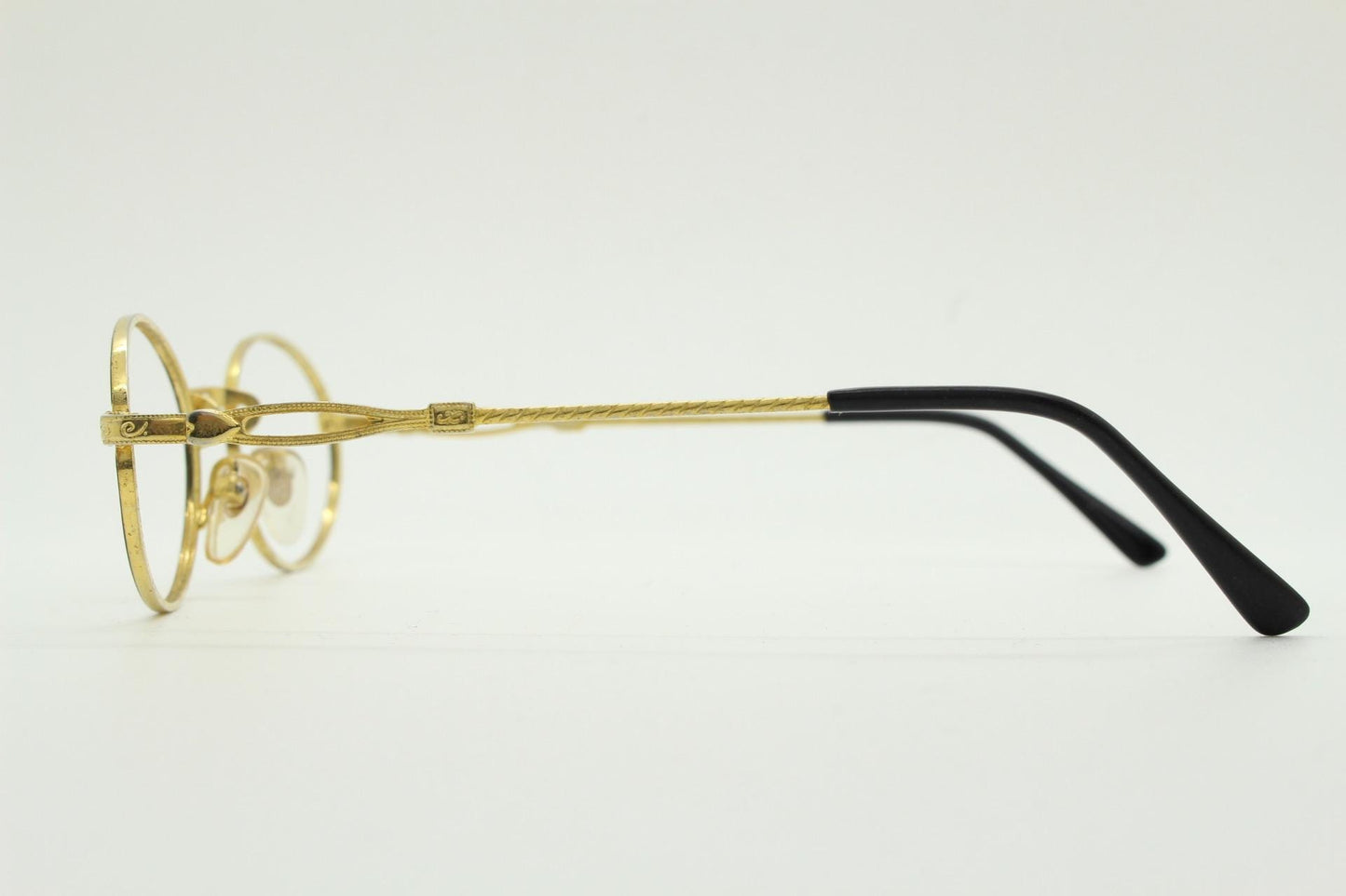 90s vintage small oval eye glasses. Gold and black optical frames with ornate arm details. Prescription RX steampunk spectacles. NOS
