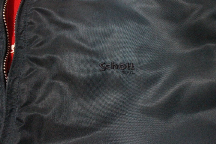 Schott NYC vintage reversible bomber jacket. Big spell out logo back in blue with red reverse side featuring white eagle. Flying MA 1.