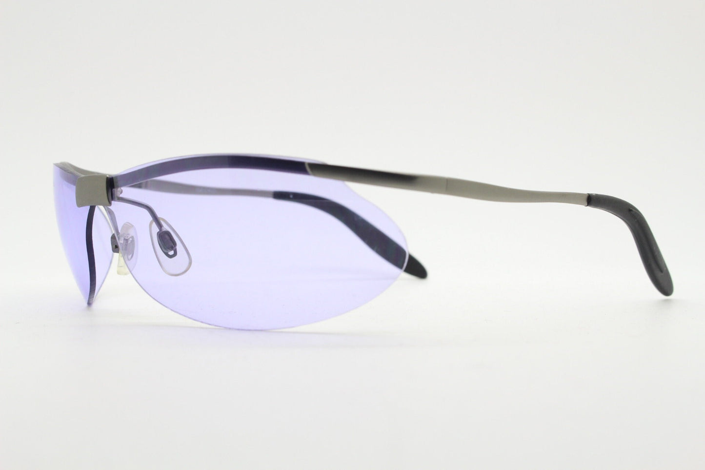Y2K vintage sport shield sunglasses. 2000's half frame wraparound aerodynamic mini mask visor with purple bug eye lenses. 90s 00s unused NOS