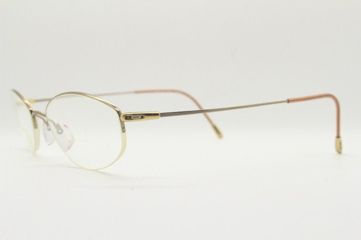 Silhouette oval half frame eye glasses model 6608 made in Austria. Minimal optical frame with extremely flexible wire arms. Prescription RX