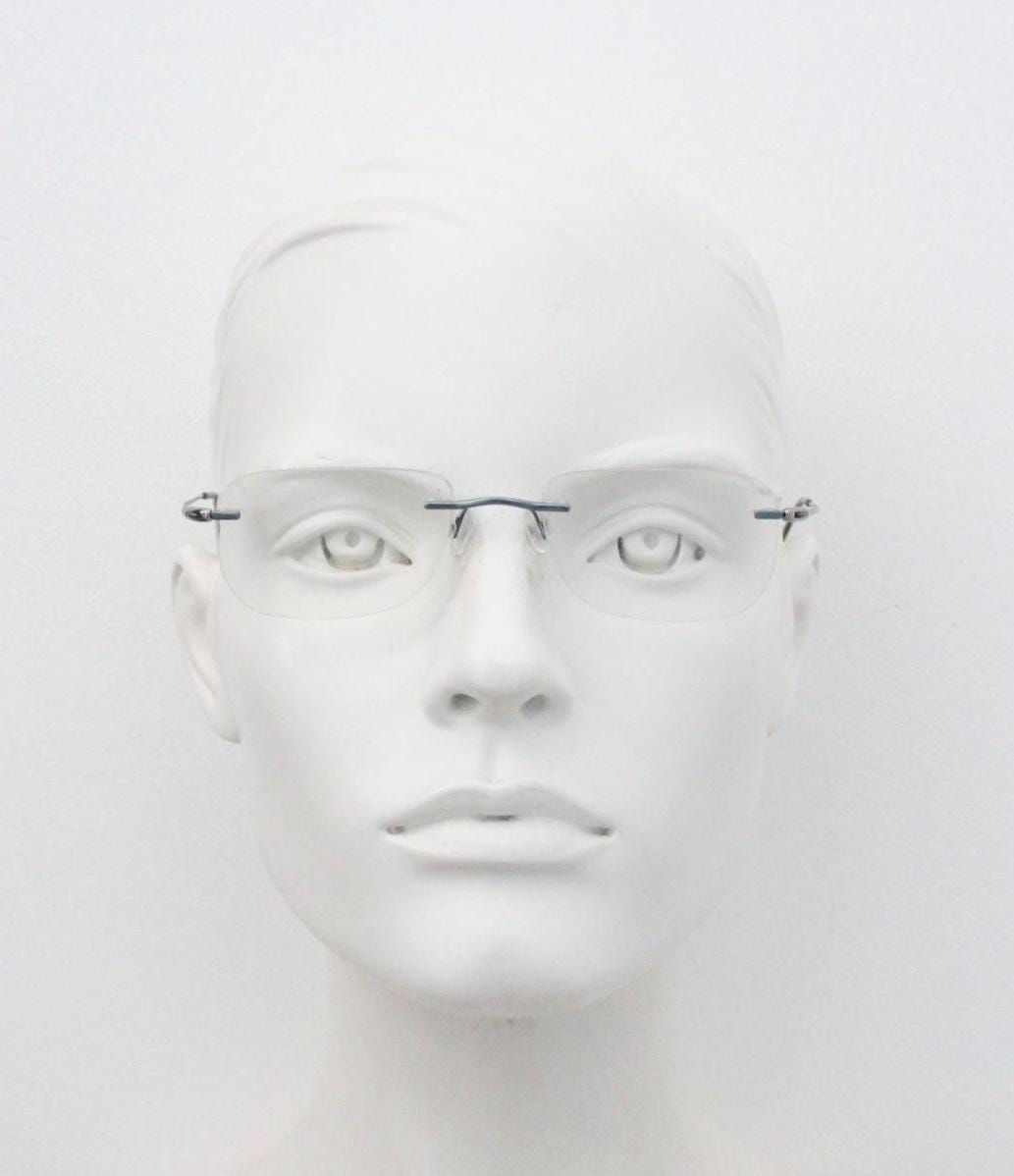 Silhouette rectangular frameless eye glasses model 7554 made in Austria. Minimal lightweight titanium optical frame. Prescription RX