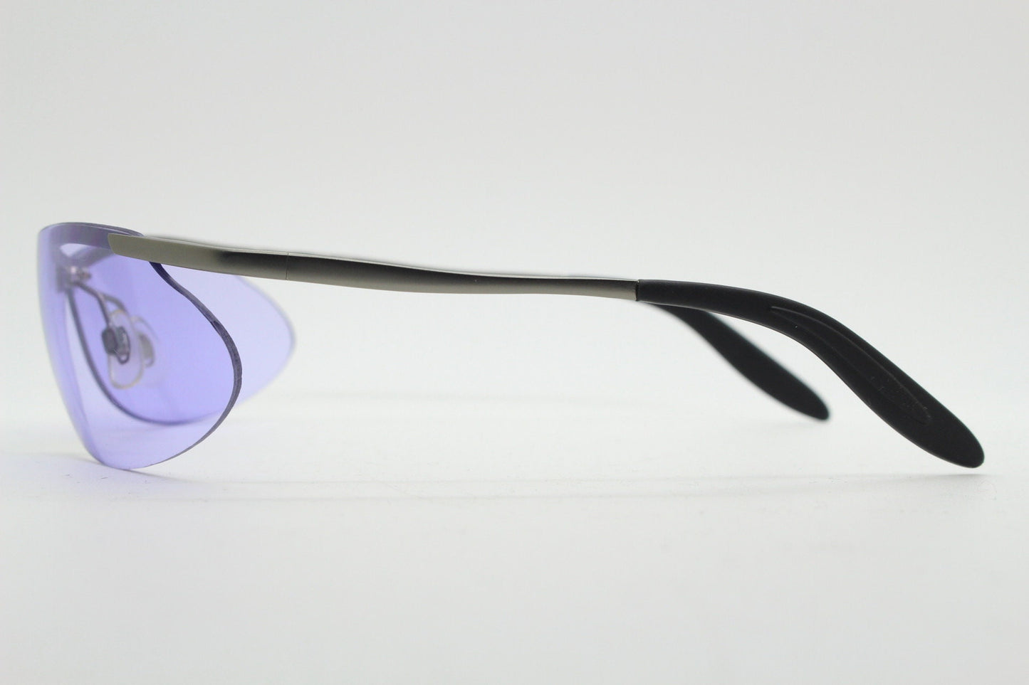 Y2K vintage sport shield sunglasses. 2000's half frame wraparound aerodynamic mini mask visor with purple bug eye lenses. 90s 00s unused NOS