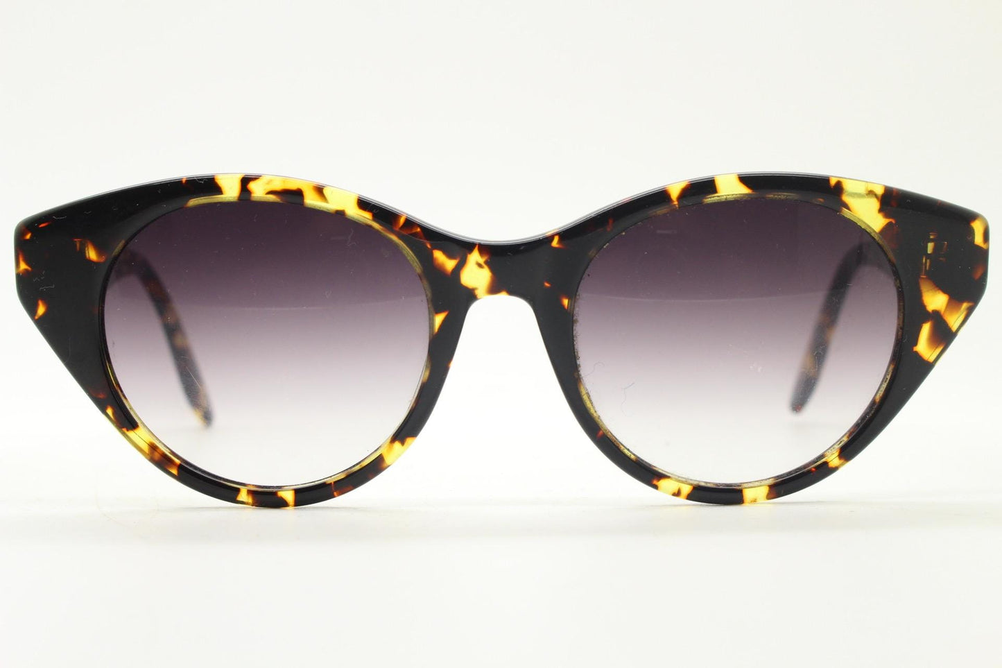 Barton Perreira subtle cat eye sunglasses model kismet. Honey tortoise acetate frame with cropped sides and graduating lenses