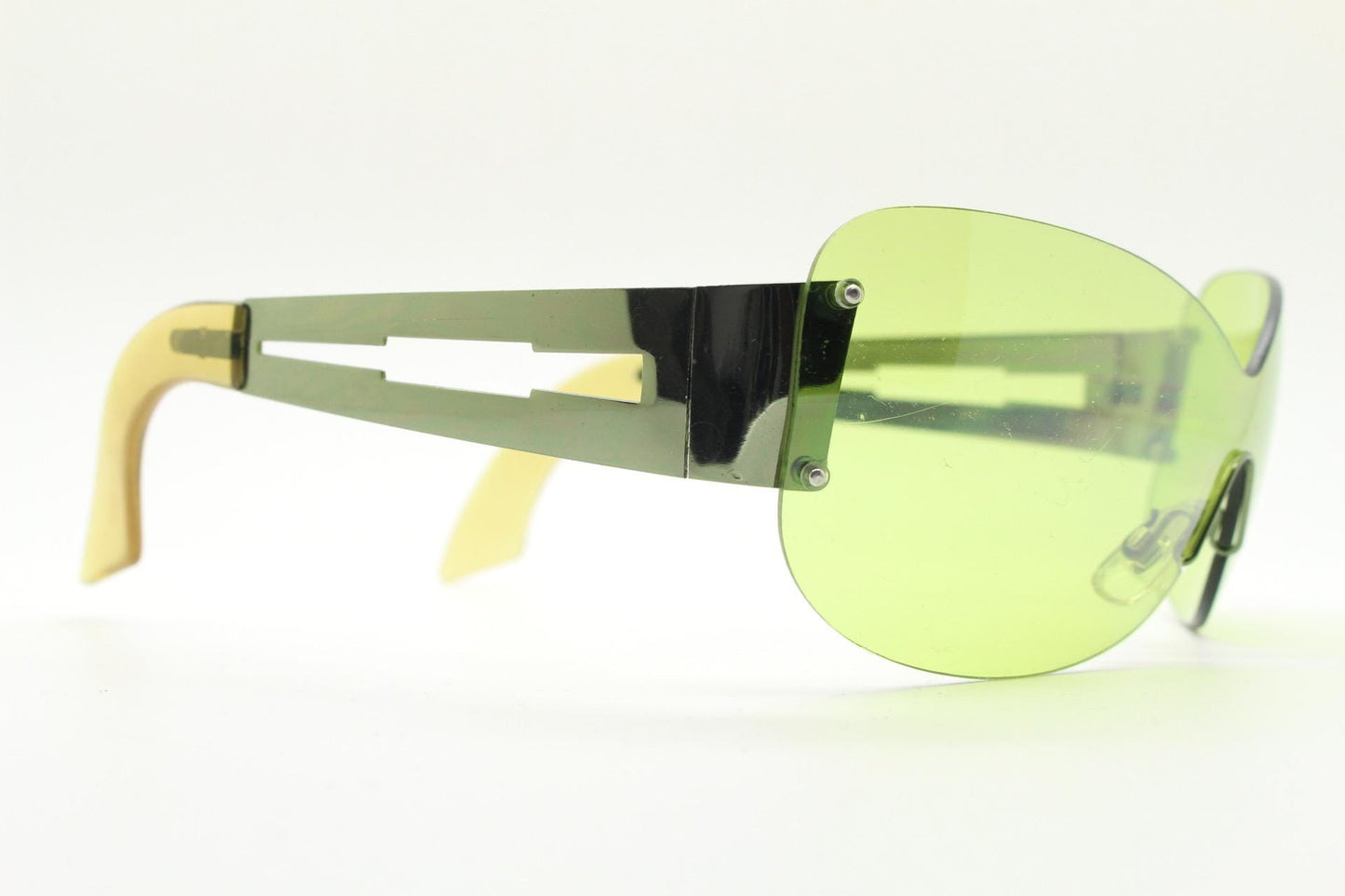 Y2K vintage frameless shield sunglasses. Dynamic 2000's green mono lens visor with matching coloured chrome arms. 00's Cosplay mini mask NOS