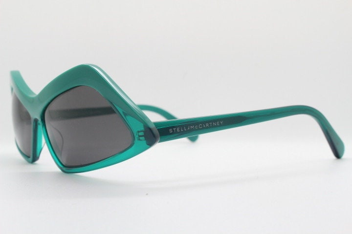 Stella Mc Cartney vintage abstract diamond sunglasses. Blockbuster fashion grail in transparent green acetate with dark lenses. NOS