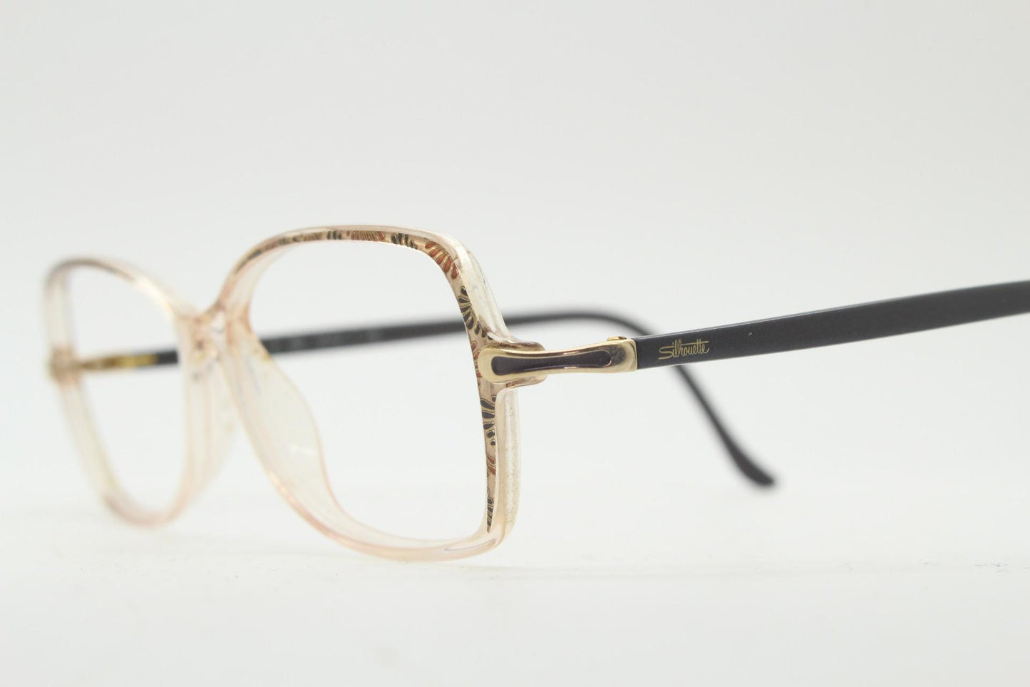 Silhouette 80s vintage oval eye glasses made in Austria. Transparent crystal optical frame with giraffe arm print. Prescription RX