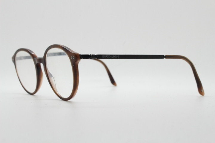Giorgio Armani eye glasses model 7124 made in Italy. Mottled brown acetate optical frames with flat metal arms. Prescription eyeglasses. RX