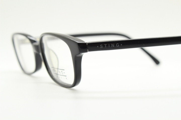 Sting 90s vintage rectangular eye glasses made in Italy. Plain black gloss low profile acetate optical frames. Prescription RX. NOS