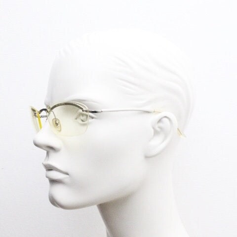 Y2K vintage half frame extra light tone yellow sunglasses with satin alloy brow line. Minimalistic 2000's wrap around design. 00's NOS