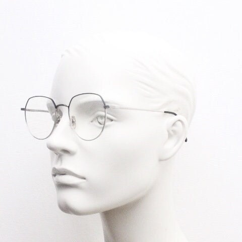 Bolon round panto flat top eye glasses model 7052. Slender silver metal optical frame with black brow. Prescription spectacles. Vintage RX