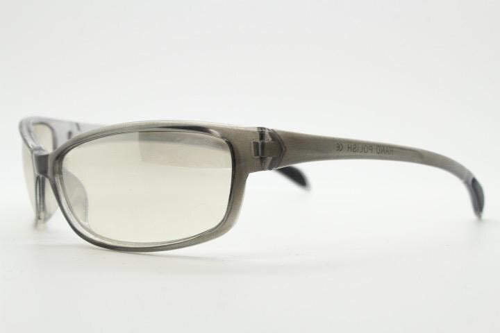 Y2K vintage futuristic sunglasses. Gloss white and grey wrap around shield style frame with light tone lenses. Cosplay visor. 2000s NOS
