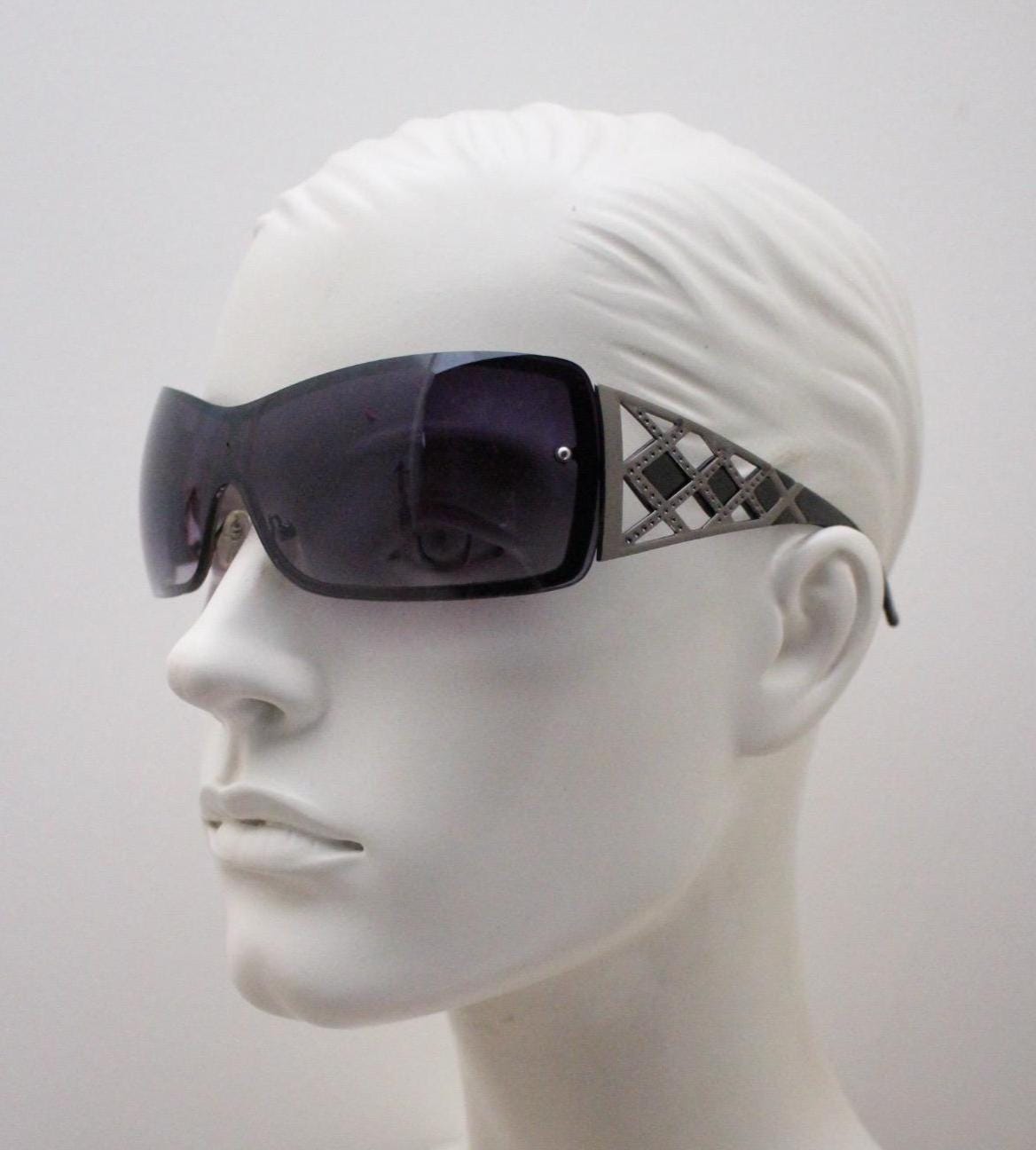 Y2K vintage visor sunglasses. 2000's grey wraparound mono lens mini mask shield design with stupendous lattice arms. Bug eye. Unworn NOS