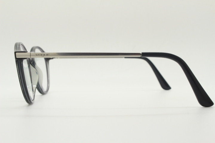 Vogue womens oval eye glasses model 5223. Black acetate optical frames with metal arms. Prescription eyeglasses. RX spectacles