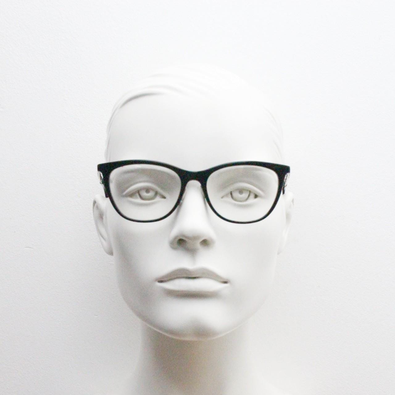 Vintage elegant cat eye glasses by Heritage. Black gloss acetate optical frames with leather lattice arms. Prescription RX cateye spectacles