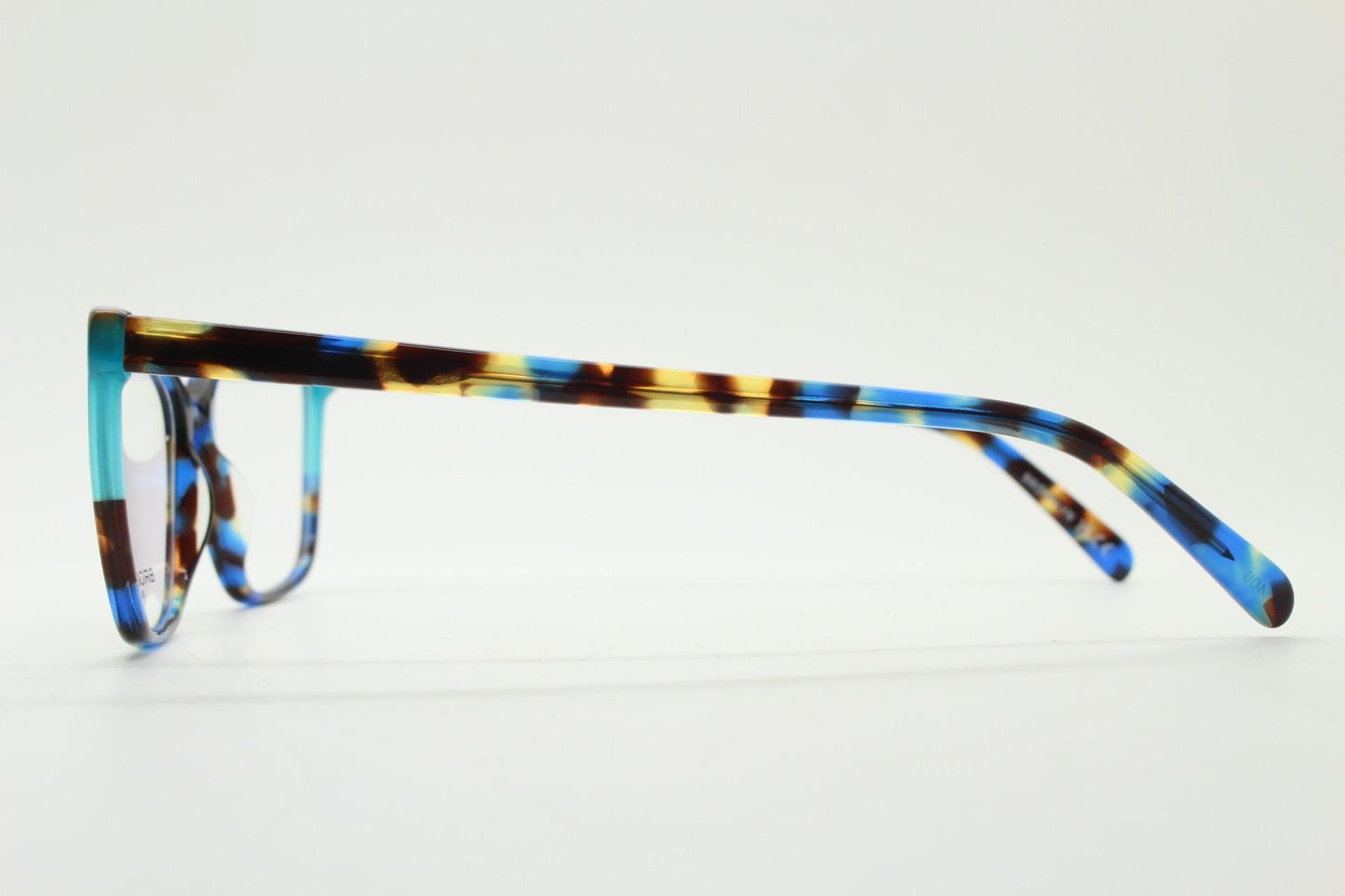 Modified cat eye glasses by Brooklyn. Vibrant blue and brown tones gloss optical frames.  Prescription eyeglasses. RX cateye spectacles