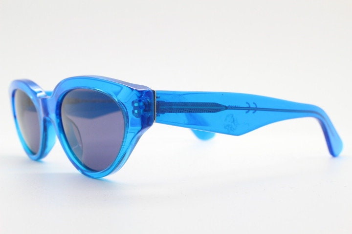 Retrosuperfuture thick cat eye sunglasses hand made in Italy. Intense blue acetate chunky frame with tasteful navy lenses. NOS