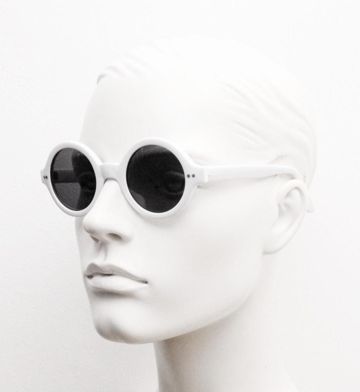 90s vintage round monochrome sunglasses. 30s design in an ice white frame with plain black lenses. Quality construction unused NOS