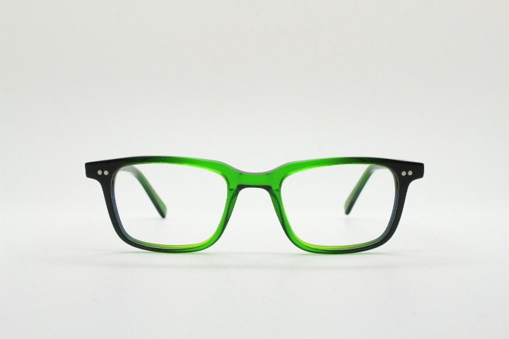Green rectangular low profile wayfarer design eye glasses by found of Switzerland. Green gloss acetate optical frames. Prescription RX