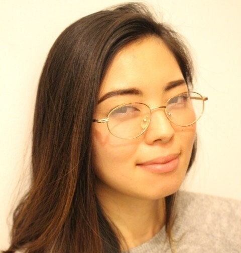 90s vintage oval eye glasses. Bright golden optical frames with coloured enamel brows. Prescription RX spectacles. Clear lens NOS