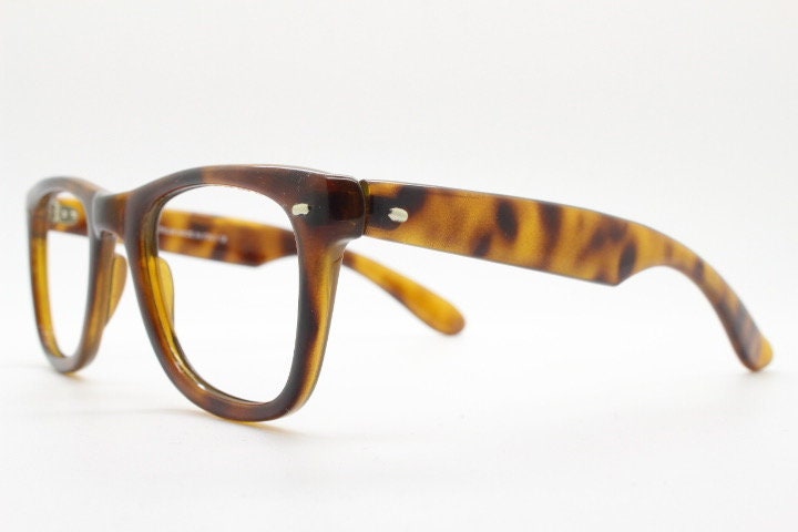 90s vintage wayfarer design eye glasses made in Italy. All time classic optical frames in mottled browns. Prescription RX eyeglasses. NOS