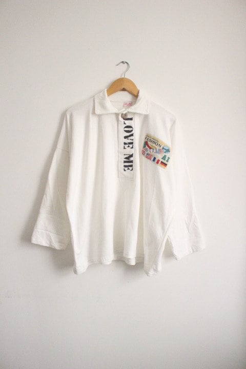 80s Vintage oversized polo shirt with 'LOVE ME' graphic print. Crop sleeve jumper. Unisex sweatshirt. Fashion grail sweater. NOS pullover