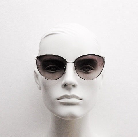 Carolina Herrera minimal cat eye sunglasses model SHN069 made in Italy. Women's  gold titanium cateye frame with brown lenses. Vintage NOS