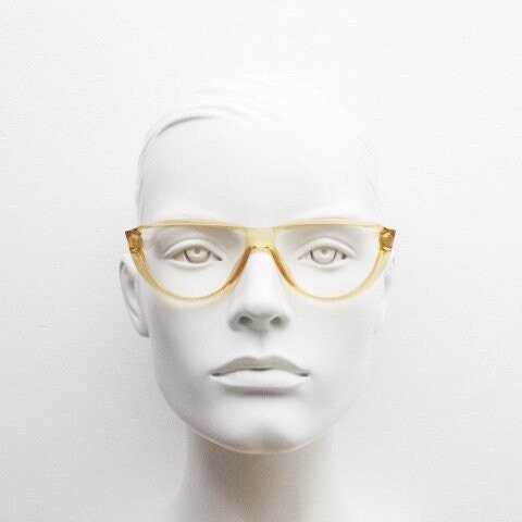 Christian Dior 80s vintage flat top cat eye glasses made in Germany. Transparent yellow optical frame with abstract print. Prescription RX