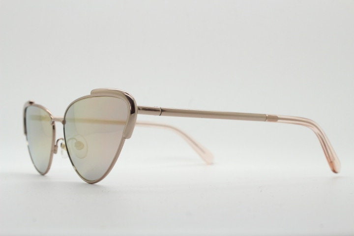 Rebecca Minkoff futuristic golden oval cat eye sunglasses. Women's rose gold metal cateye frame with sunburst mirror lenses. NOS