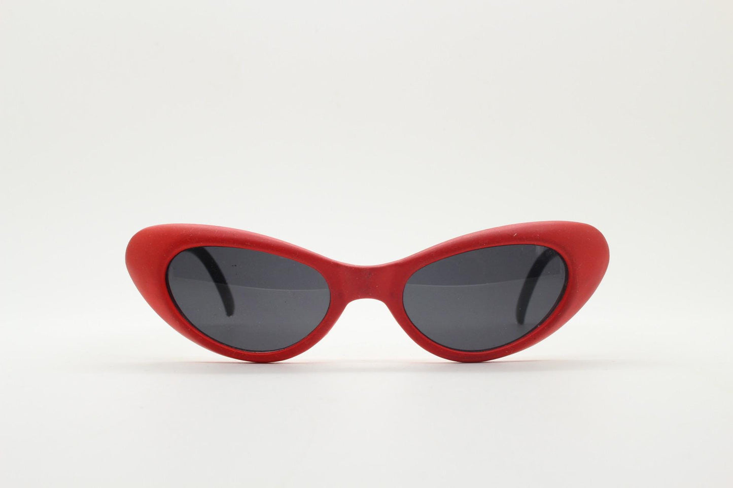Vintage 80s oval cat eye sunglasses. Dynamic red rubber front with black gloss arms. Hyper real cosplay cateye. New wave punk