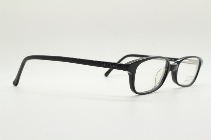Sting 90s vintage rectangular eye glasses made in Italy. Plain black gloss low profile acetate optical frames. Prescription RX. NOS