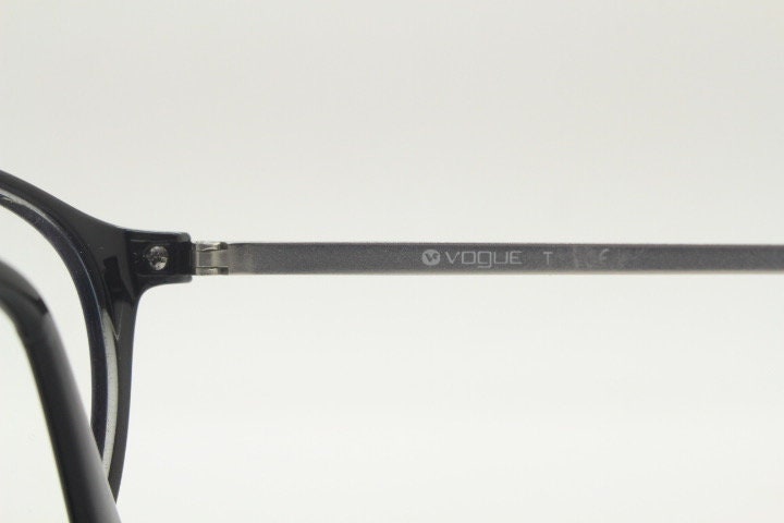 Vogue womens oval eye glasses model 5223. Black acetate optical frames with metal arms. Prescription eyeglasses. RX spectacles