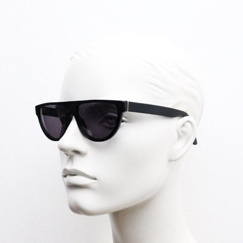 Retrosuperfuture thick flat top cat eye sunglasses hand made in Italy. All black gloss acetate frame. Vintage