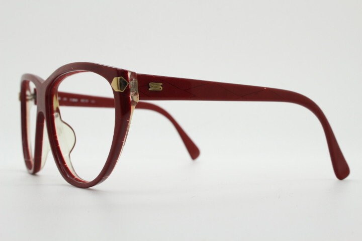Silhouette 80s vintage oversized cat eye glasses made in Austria. Dramatic red prescription optical frame with subtle criss cross stripes RX