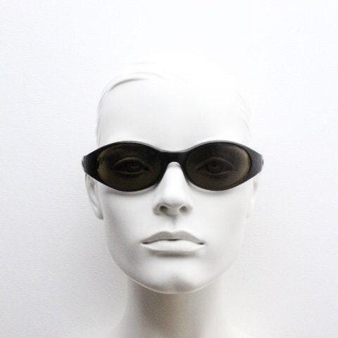 Carrera 90s vintage shield sunglasses made in Italy. Aerodynamic brown wrap around sport frame with big spell out logo. Bug eye. BNWT. NOS