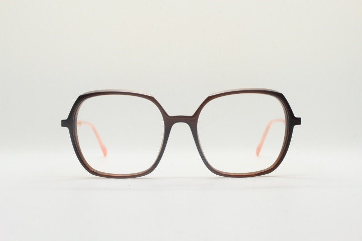 Caroline Abram square hexagon eye glasses model Caline. Dark brown acetate optical frame with pink arms. Prescription RX spectacles