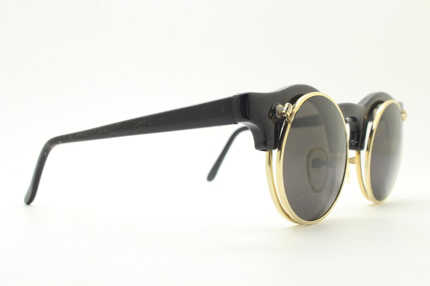 Vintage 80s round flipper sunglasses. Black gloss frame with clear lenses and incredible side flip up shades . BNWT unused NOS