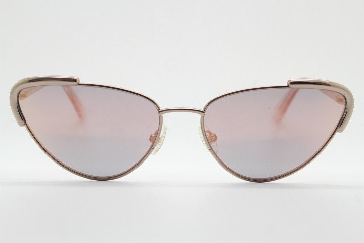 Rebecca Minkoff futuristic golden oval cat eye sunglasses. Women's rose gold metal cateye frame with sunburst mirror lenses. NOS