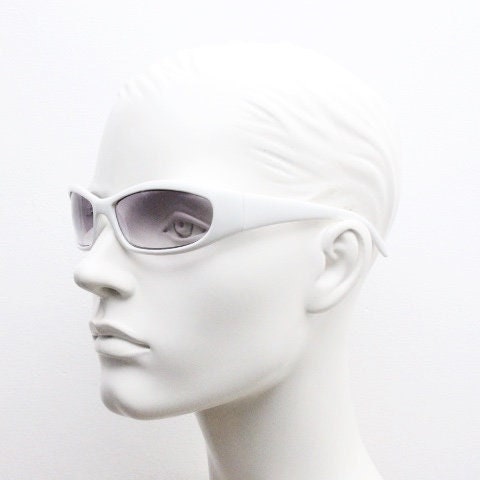 Y2k vintage wrap around bug eye sunglasses. Curving ice white shield frame with light tone lenses. Rave. Super hero cosplay 2000s NOS