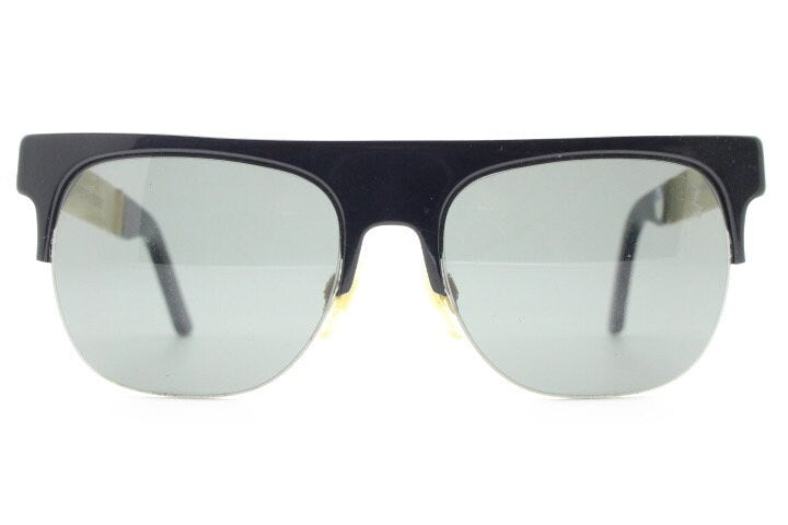 Retrosuperfuture vintage flat top half frame sunglasses hand made in Italy. Black gloss acetate front with tall golden arms