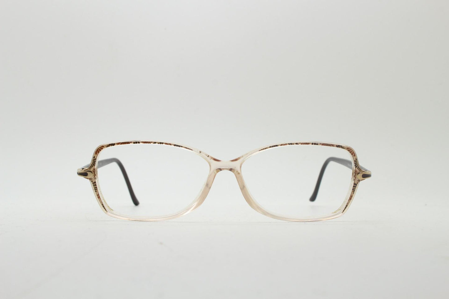 Silhouette 80s vintage oval eye glasses made in Austria. Transparent crystal optical frame with giraffe arm print. Prescription RX